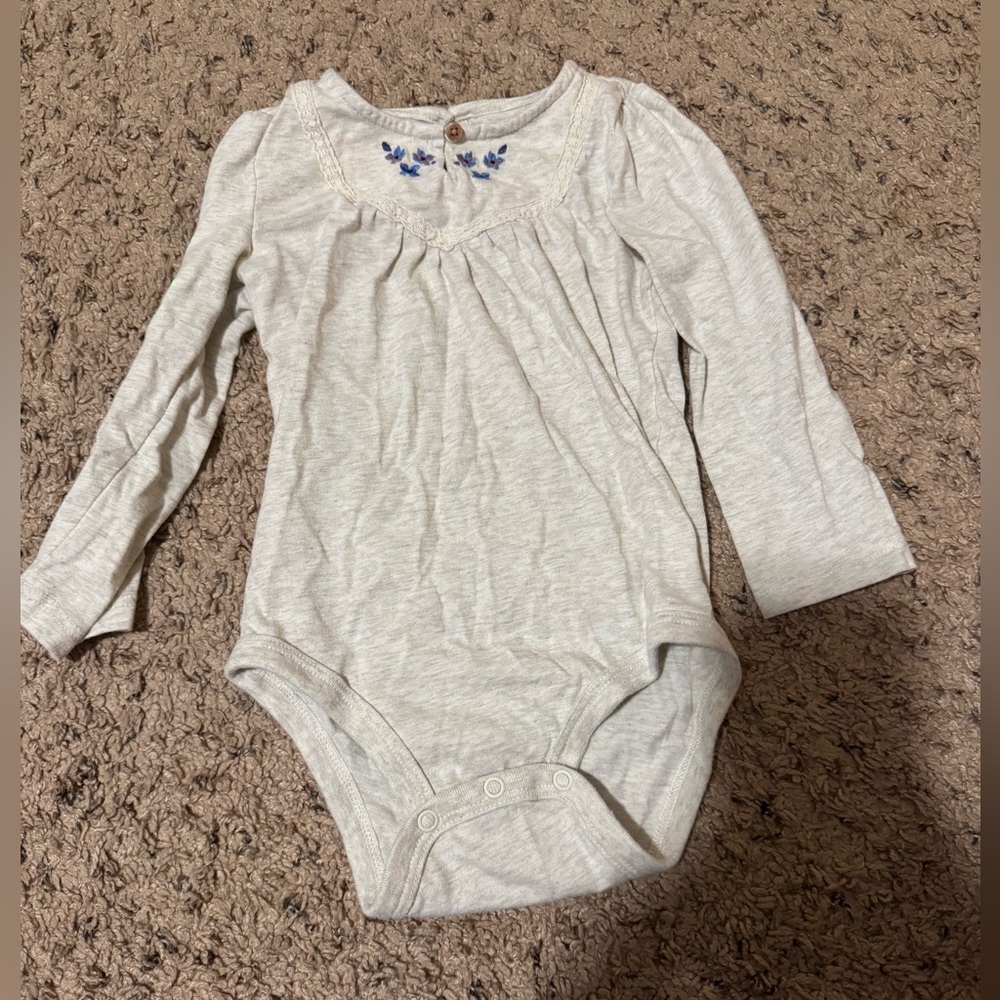 Charming Cream Baby Bodysuit with Blue Accents
